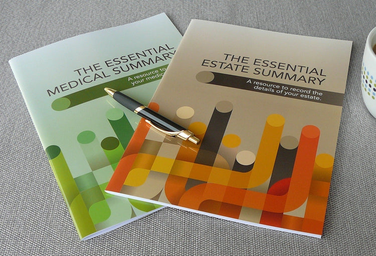 Copies of the Essential Estate Summary and Essential Medical Summary with a pen on a grey surface.
